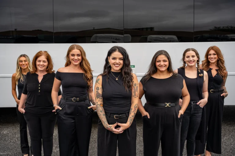 Ace Limousine events team standing in front of a coach bus